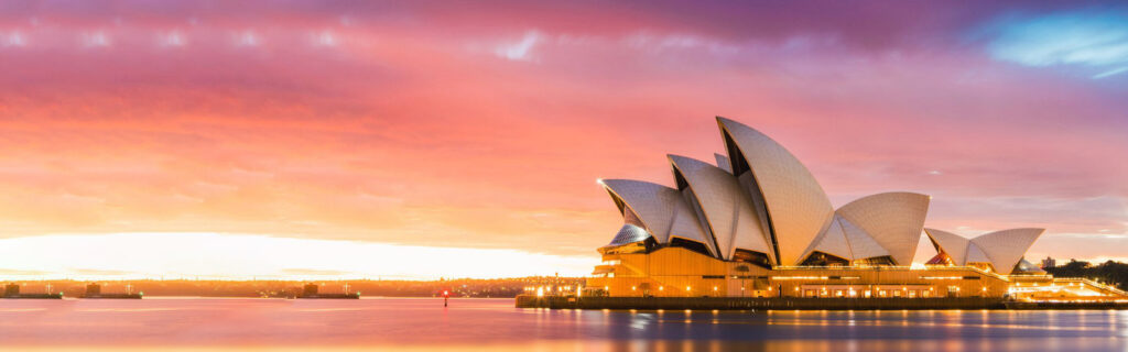 Sydney Opera House and harbour at sunset